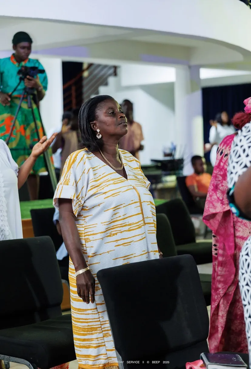 A woman listening during the service